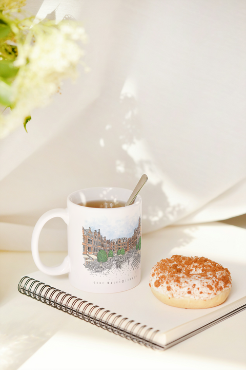 White ceramic mug featuring an illustrated design of Leuven's iconic landmark Oude Markt.