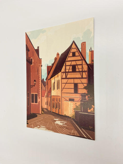 Featuring detailed illustrations of the city’s iconic corner, Mechelsestraat, this postcard is a perfect memento or gift for those who appreciate the city's historical beauty.