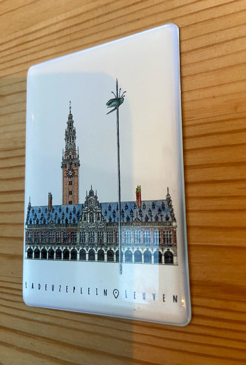 Epoxy fridge magnet featuring a detailed illustration of Leuven’s iconic square, Ladeuzplein with the text “LAdeuzeplein • Leuven” on a glossy rectangular surface