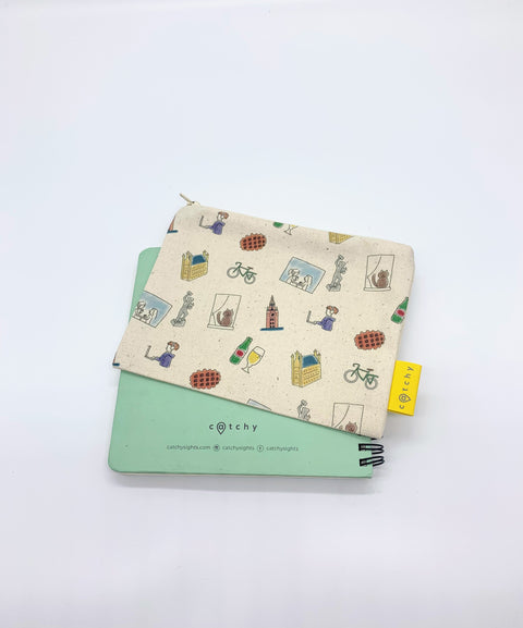 Handmade mini zipper pouch made from 100% cotton, featuring a pattern with small symbols representing Leuven. Compact and lightweight, perfect for storing keys, money, earphones, and other small essentials