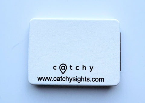Double-sided pocket mirror with playful navy blue illustrations of Leuven icons, including bikes, trees, drinks, and architecture, and the text “Leuven things” on a light background.