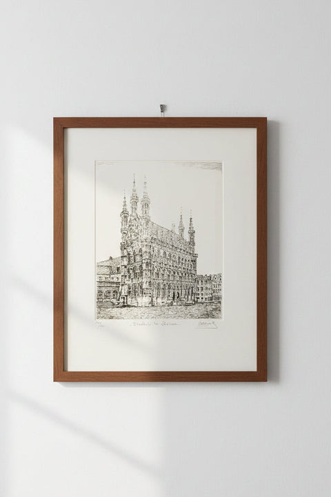 Limited-edition etching of the Old Town Hall in Leuven by Belgian artist André Wellens. Handmade using traditional acid etching on eco-friendly paper. A rare collector’s piece, individually signed and numbered, with no reprints available. Perfect gift for architecture and fine art lovers.