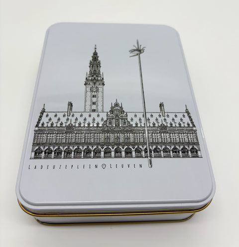 A rectangular metal tin box with a black line of art illustration of Leuven’s
iconic landmark, OLD own Hall, on the lid.