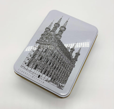 A rectangular metal tin box with a black line of art illustration of Leuven’s
iconic landmark, OLD own Hall, on the lid.