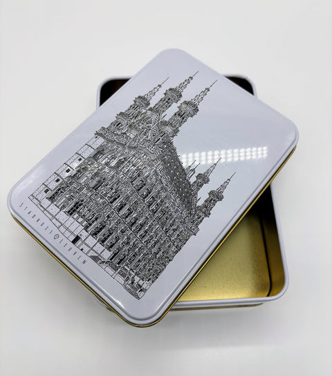 A rectangular metal tin box with a black line of art illustration of Leuven’s
iconic landmark, OLD own Hall, on the lid.