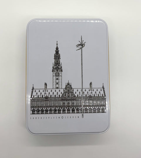 A rectangular metal tin box with a black line of art illustration of Leuven’s
iconic landmark, OLD own Hall, on the lid.