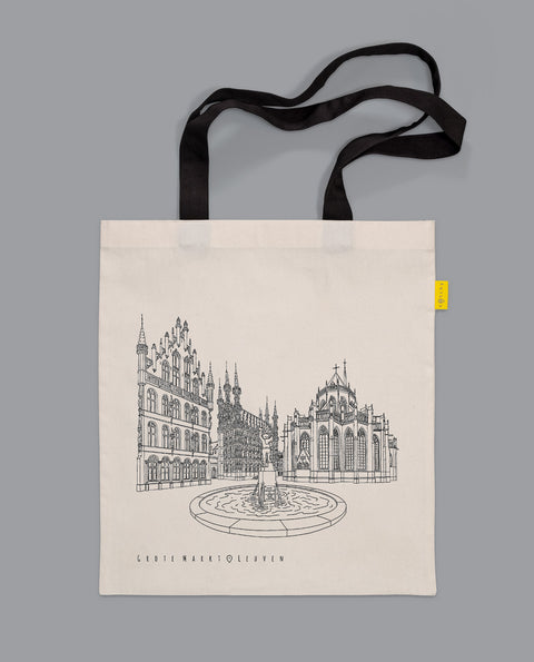 Canvas tote bag with black handles featuring a line art illustration of Leuven’s Grote Markt, including the Town Hall, Fonske fountain, and Saint Peter’s Church