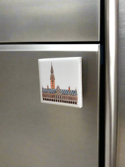 Ceramic fridge magnet featuring a detailed illustration of Leuven's iconic building, KU Leuven library.