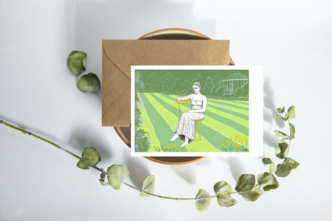 A beautifully illustrated postcard featuring ‘Zittend Meisje’ (A Lady in the Botanical Garden), a statue by Lydia Stefa located in Leuven’s Botanical Garden. Part of a series celebrating the city’s renowned female statues. Printed on high-quality American Bristol paper and includes a matching envelope, perfect for mailing, gifting, or collecting.