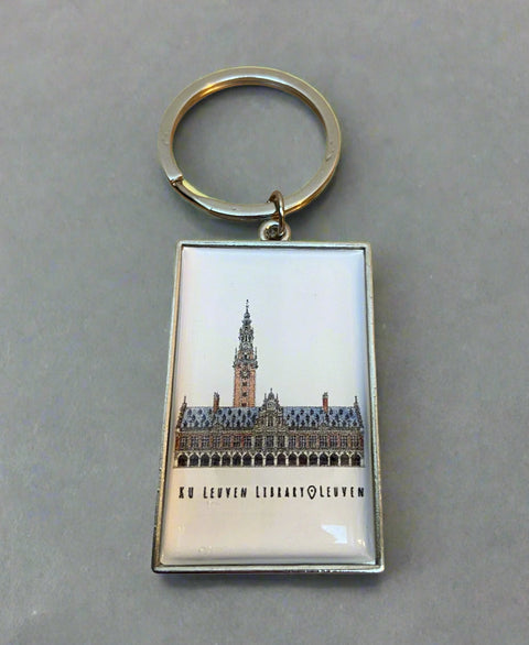 Metal keyring with a rectangular charm featuring an illustrated view of Leuven’s iconic building , KU Leuven library.