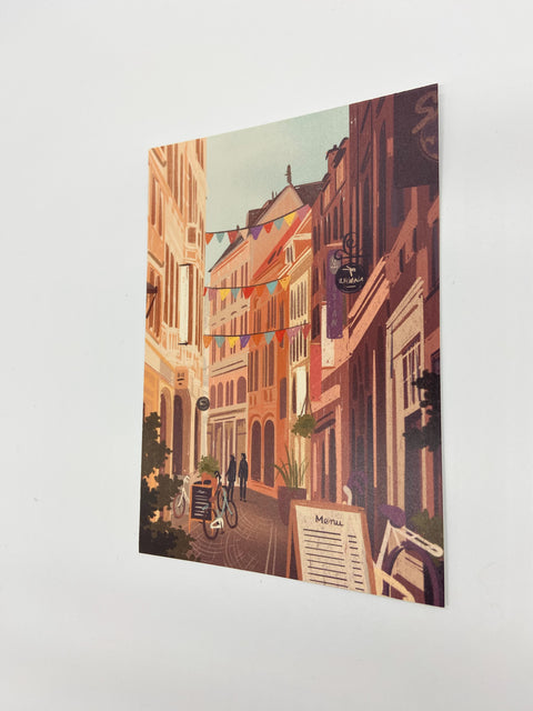 Featuring detailed illustrations of the city’s iconic corner, Mechelsestraat, this postcard is a perfect memento or gift for those who appreciate the city's historical beauty.