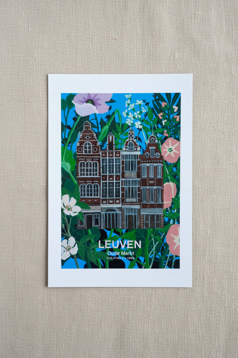 A vertical art print of Leuven, Oude Markt,  featuring a colorful illustration of historic canal houses surrounded by green foliage and pink and white flowers, displayed on a textured beige linen background.