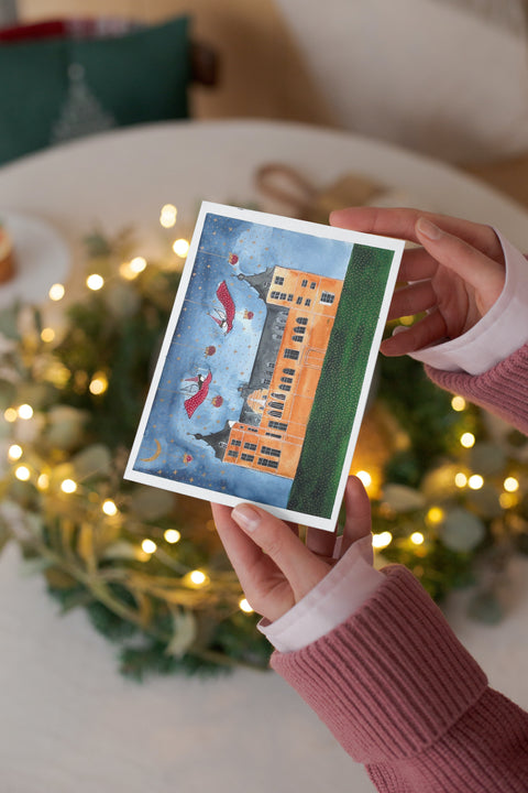 A beautifully illustrated postcard featuring Leuven’s Historical City Hall inside a snow globe, part of a popular series combining natural beauty with stars and angels. Printed on premium paper, includes a matching envelope—perfect for mailing, gifting, or collecting as a charming Leuven souvenir