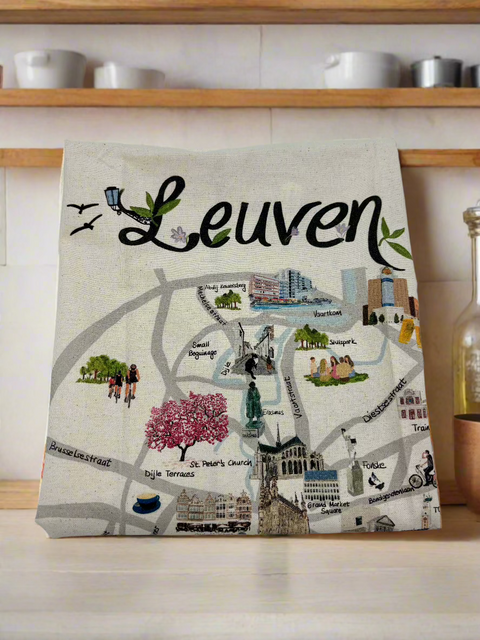 Cotton tea towel featuring a colorful illustrated map of Leuven with key landmarks, parks, and city highlights on a light background