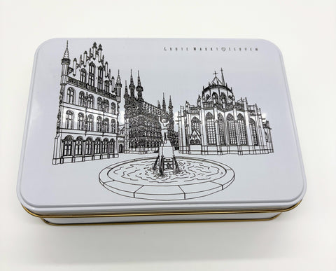 A rectangular metal tin box with a black line of art illustration of Leuven’s Grote Markt features the Town Hall, Fonske fountain, and Saint Peter’s Church on the lid.