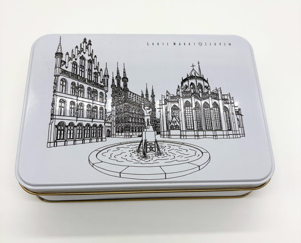 A rectangular metal tin box with a black line of art illustration of Leuven’s Grote Markt features the Town Hall, Fonske fountain, and Saint Peter’s Church on the lid.