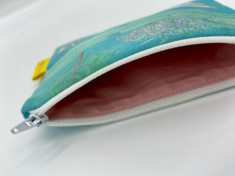 Handmade zipper pouch featuring screen-printed illustrations of famous female statues in Leuven, including Fiere Margriet. Lined interior and perfect for everyday essentials.