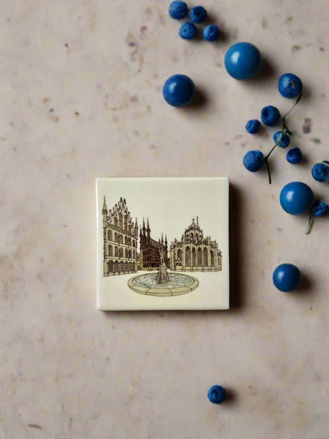 Stylish ceramic coaster featuring Grote Markt Leuven’s iconic place. Made from durable ceramic with a soft EVA backing to protect surfaces. Perfect for home, office, or as a unique Leuven souvenir. Square design (10 x 10 cm), ideal for cups and mugs. A must-have keepsake for Leuven lover. 